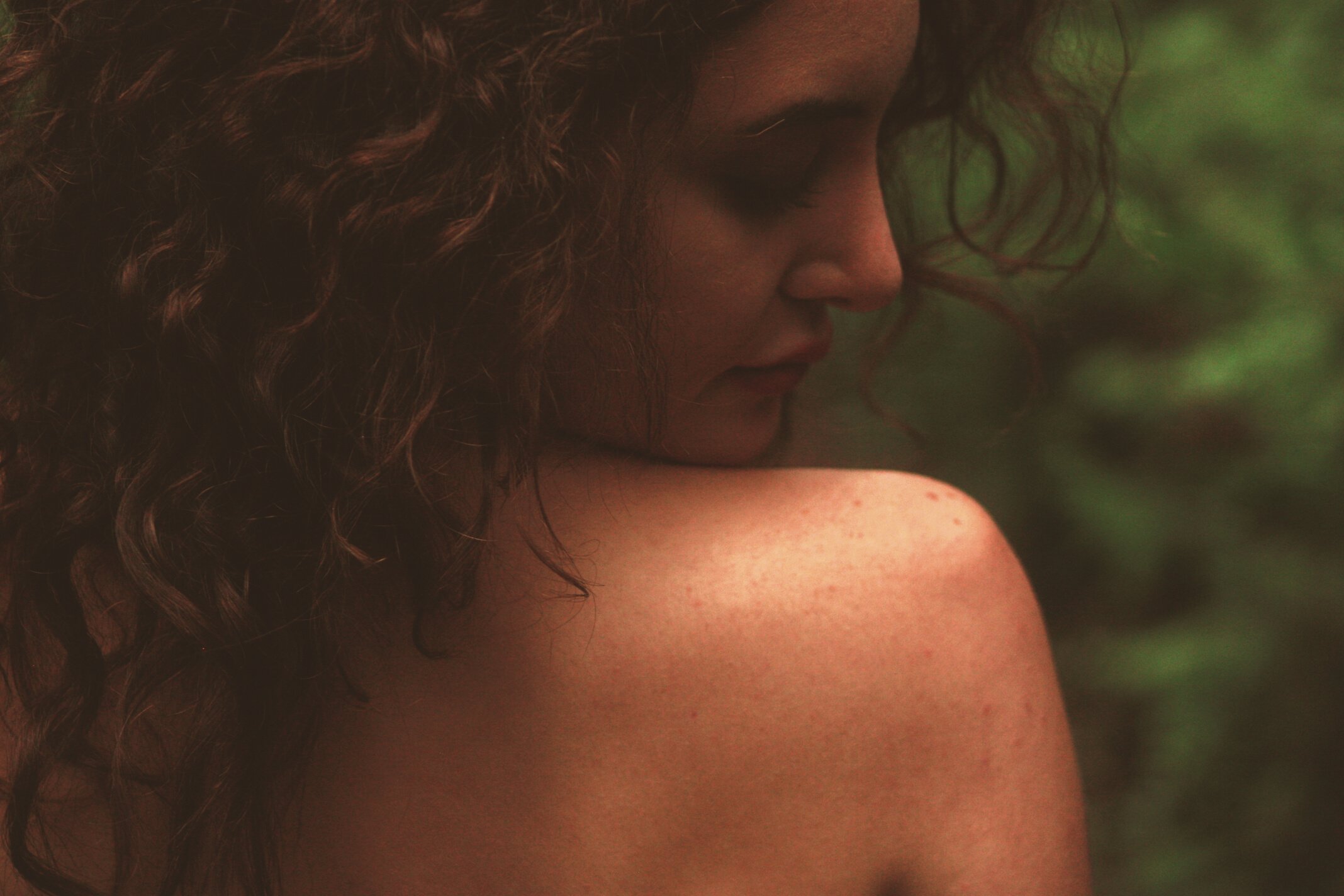 Selective Focus Photography of Woman Looking Unto Her Right Shoulder